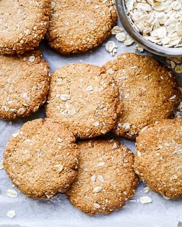 This easy buckwheat ANZAC cookies recipe is gluten free, dairy free and nut free. A simple vegan cookie with that classic combo of oats and coconut! Recipe by Nourish Everyday