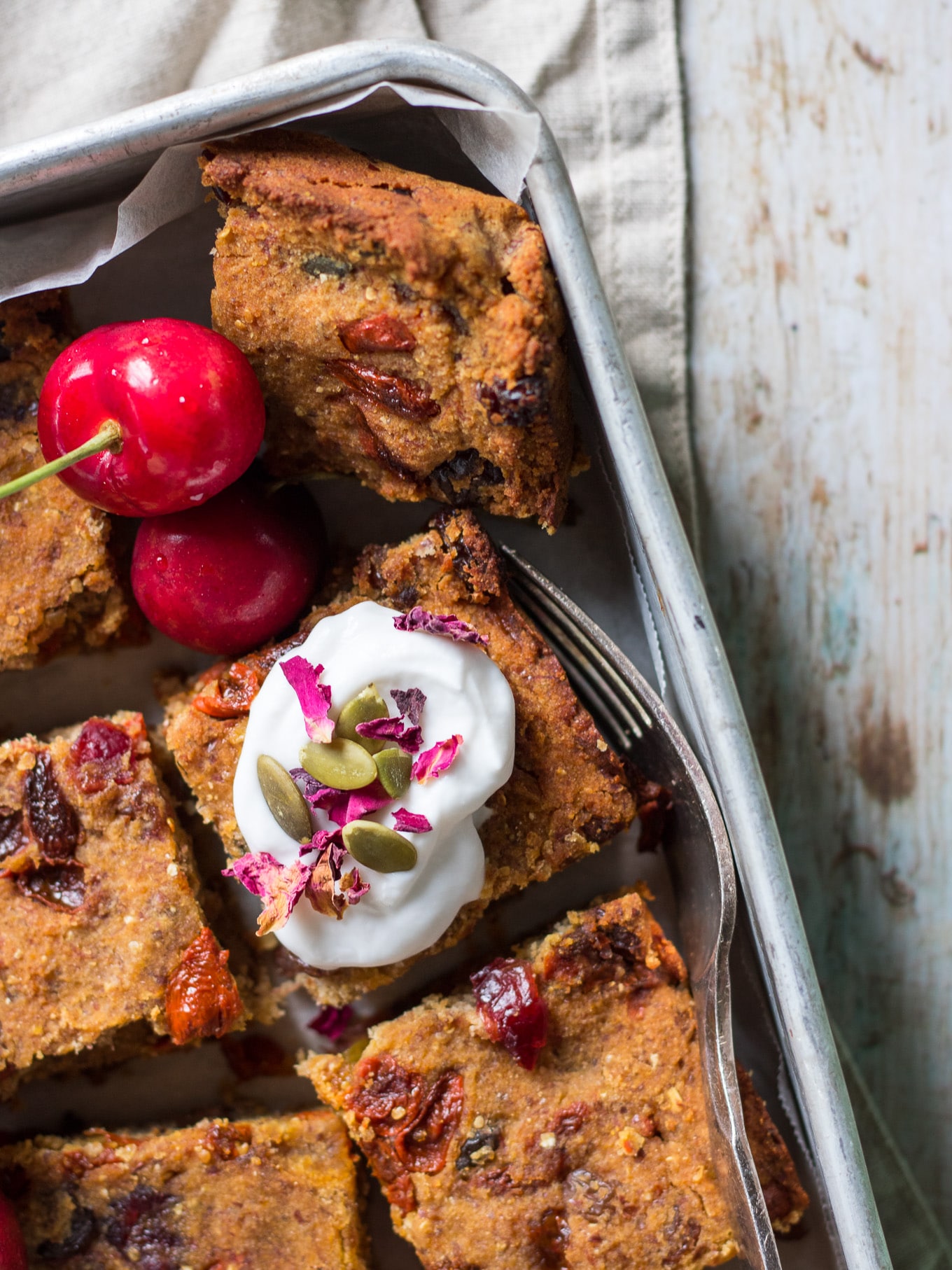 Nut Free Vegan Fruit Slice is made with coconut flour, brown rice flour, banana and tahini. Studded with loads of dried fruit. A healthier sweet treat! #fruitslice #vegan #glutenfree