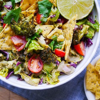 Vegan friendly Roasted Broccoli and Guacamole Salad | wordpress-6440-15949-223058.cloudwaysapps.com | all the goodness of a big green salad mixed with lots of avocado and lime, so easy and delicious!