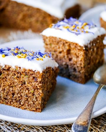 This gluten free zucchini cake recipe combines ground roasted hazelnuts, oats and buckwheat to make a healthier cake that's soft and delicious! Recipe via wordpress-6440-15949-223058.cloudwaysapps.com
