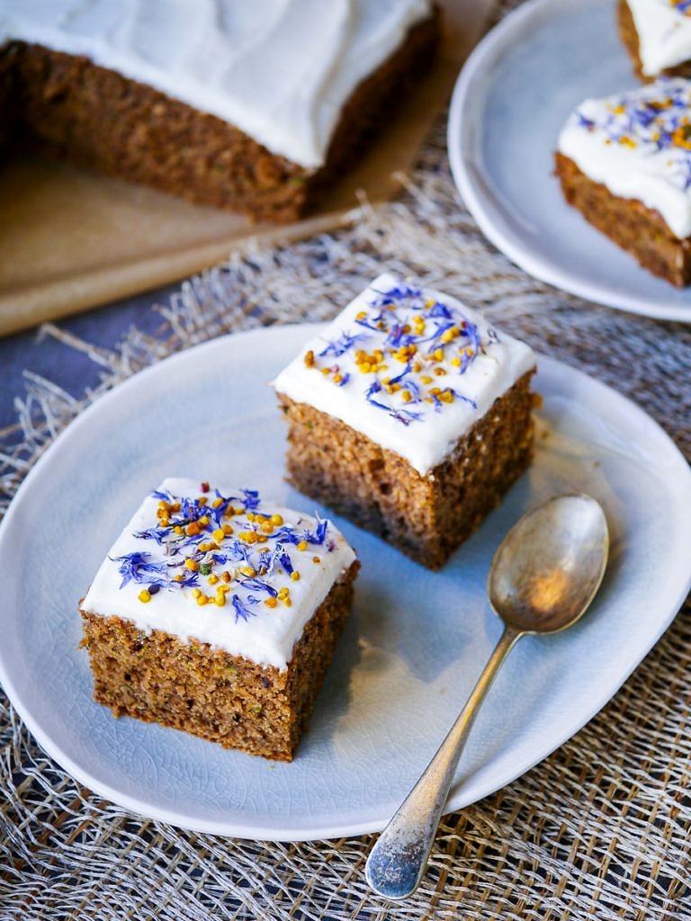This gluten free zucchini cake recipe combines ground roasted hazelnuts, oats and buckwheat to make a healthier cake that's soft and delicious! Recipe via wordpress-6440-15949-223058.cloudwaysapps.com