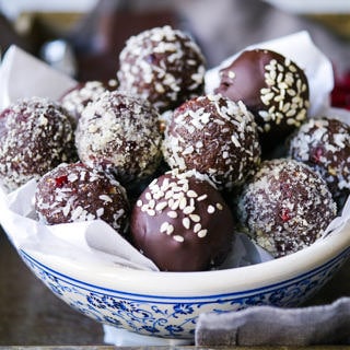 Cranberry and date chocolate truffles are a dreamy dairy free, gluten free treat. Nuts and coconut flour create a healthy spin on a chocolate truffle! Recipe via wordpress-6440-15949-223058.cloudwaysapps.com