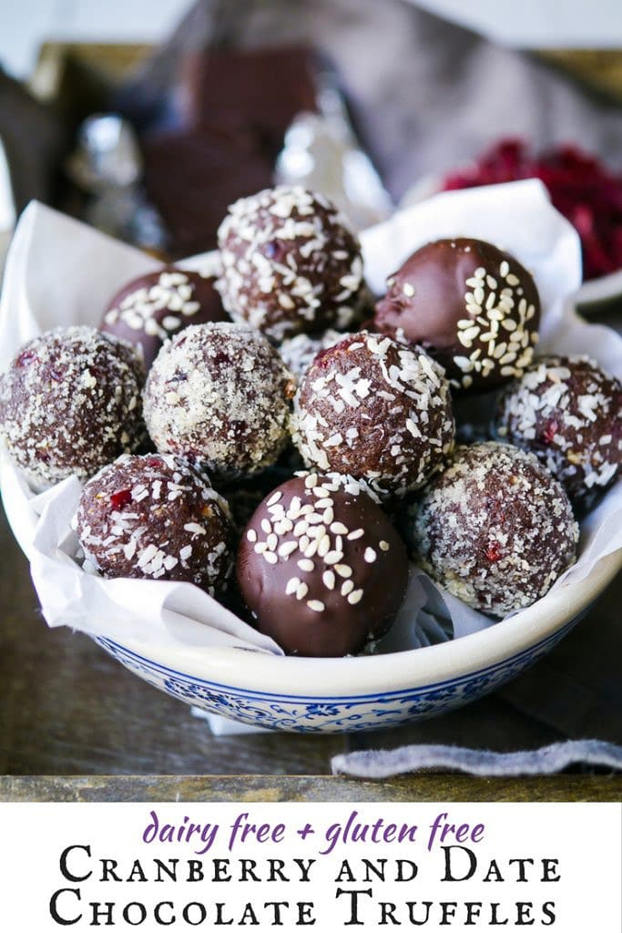Cranberry and date chocolate truffles are a dreamy dairy free, gluten free treat. Nuts and coconut flour create a healthy spin on a chocolate truffle!