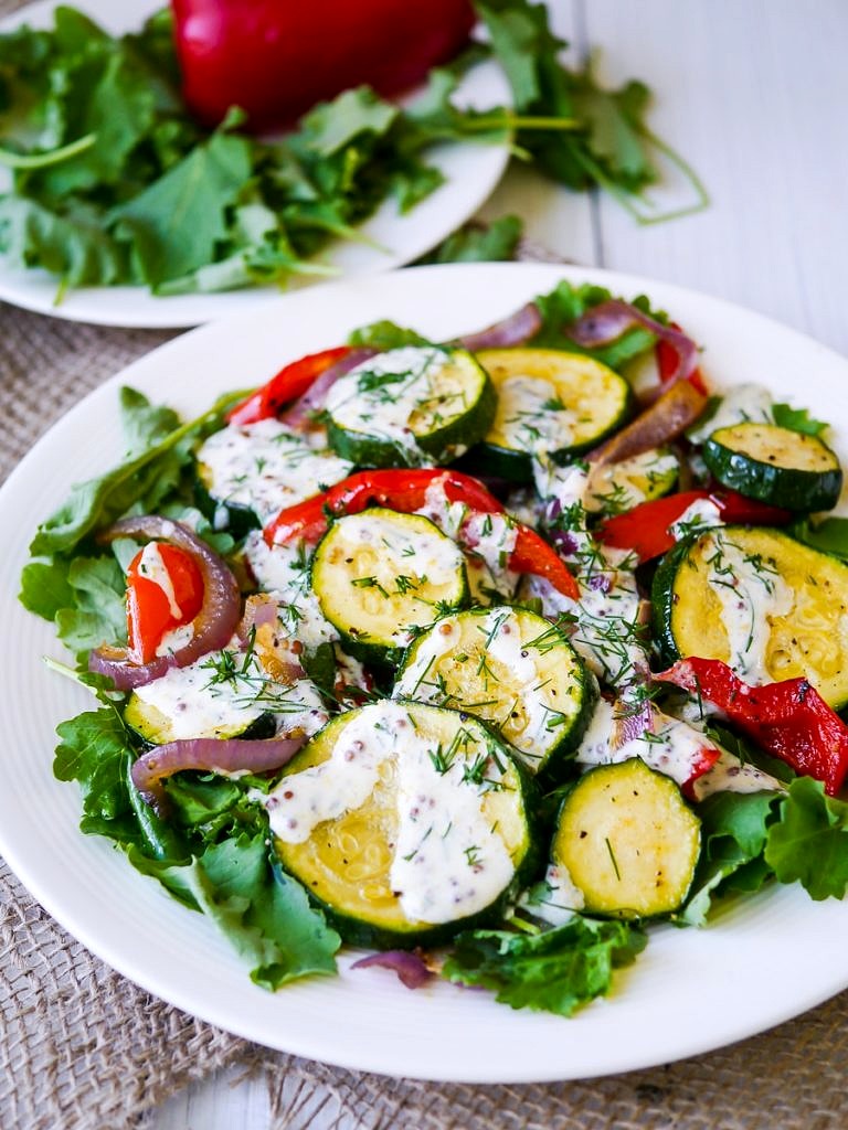 This healthy roasted zucchini salad recipe is quick and easy to prepare. Gluten free & grain free, topped with a creamy yoghurt-dill dressing!