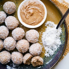 Healthy protein balls with peanut butter and coconut on a blue ceramic plate