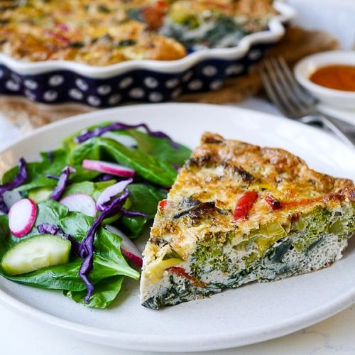 https://nourisheveryday.com/wp-content/uploads/2017/05/Pesto-Vegetable-Frittata-2-500x500.jpg