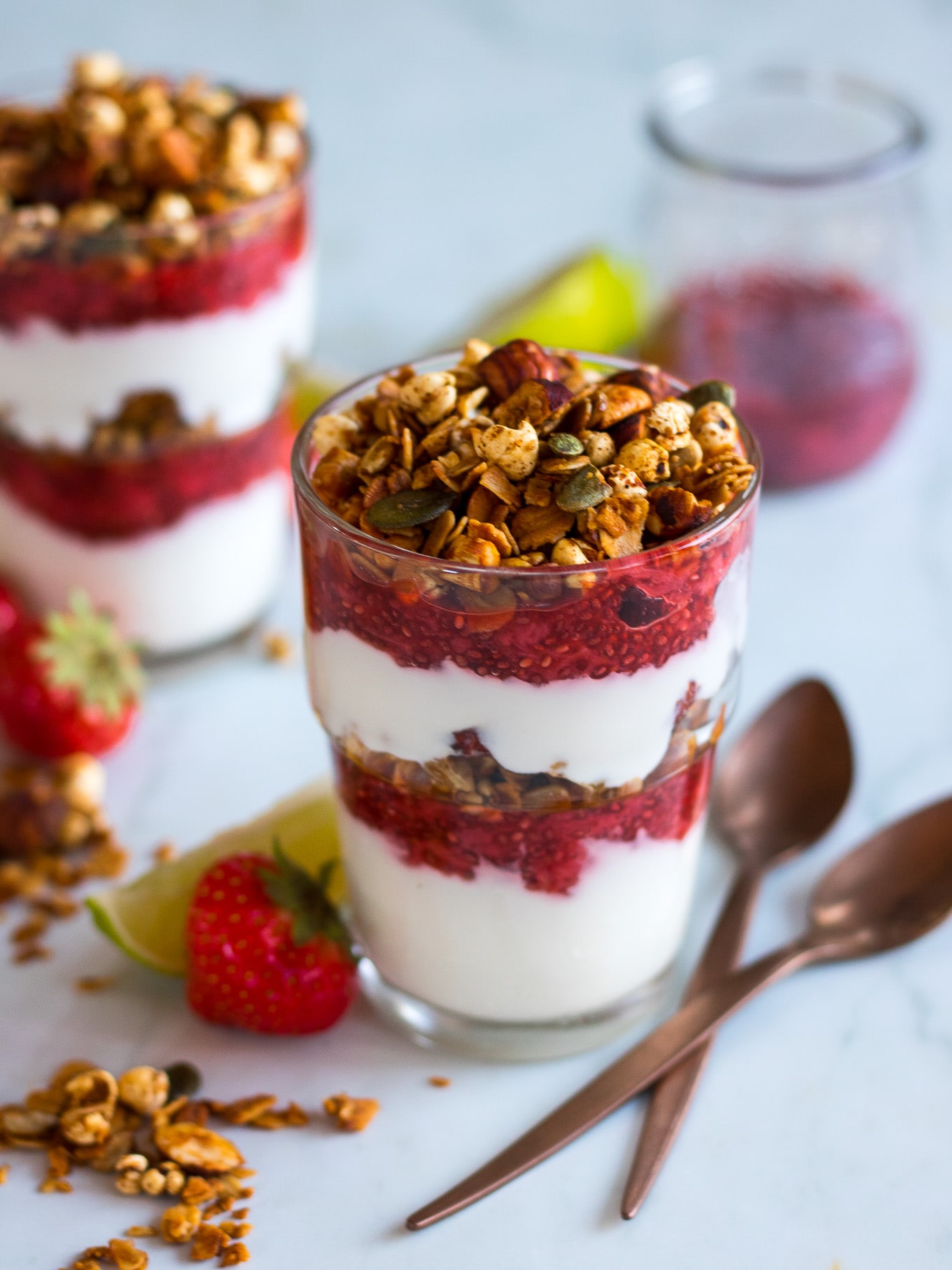 Strawberry Lime Chia Yoghurt Parfaits make a beautiful but simple breakfast, snack or even a healthy dessert! They’re perfect to meal prep and can be made gluten free and dairy free too.