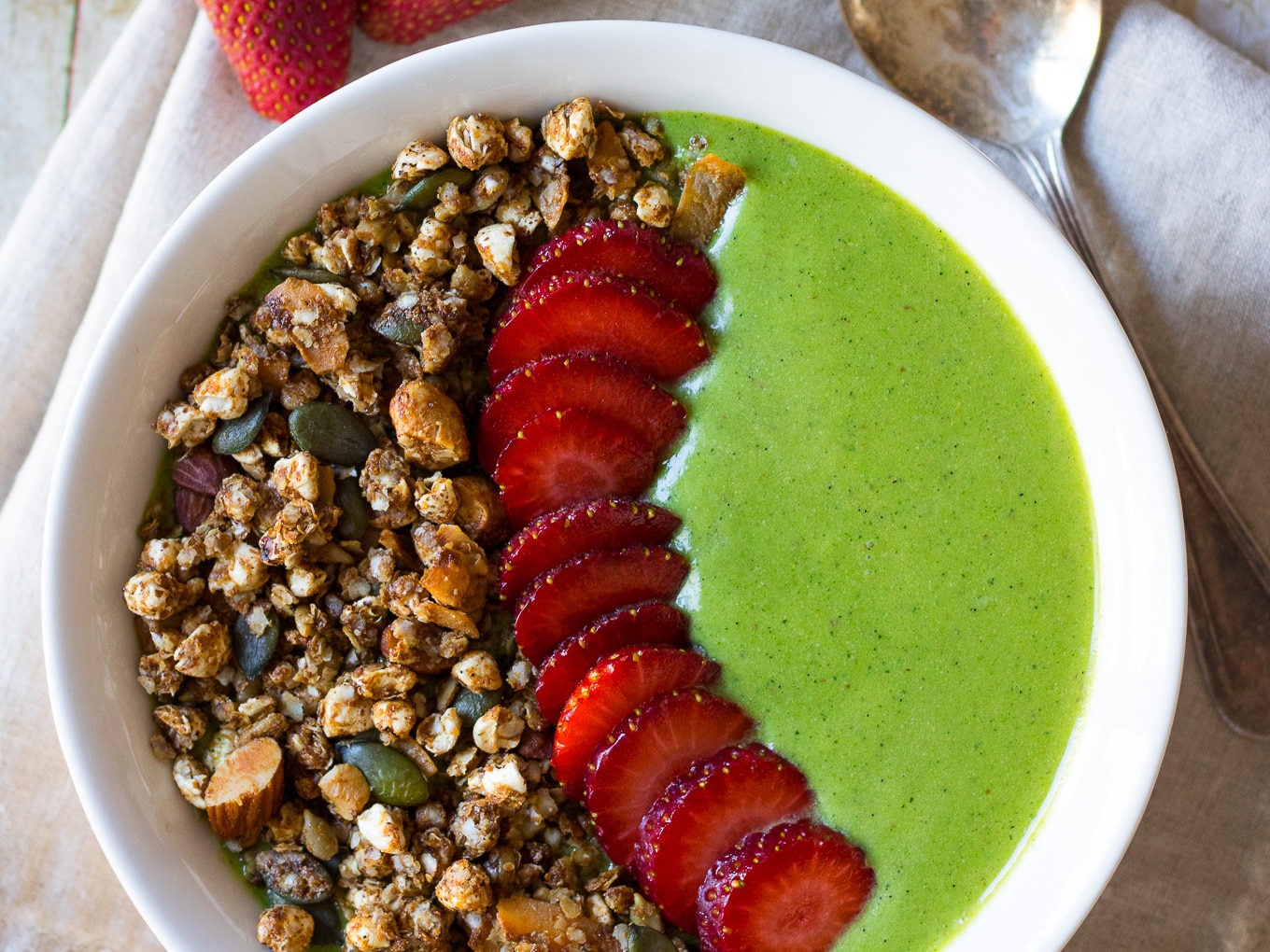A thick green protein #smoothiebowl is a quick, satisfying healthy breakfast ready in no time. #paleo and #glutenfree, with an easy vegan #dairyfree option too.