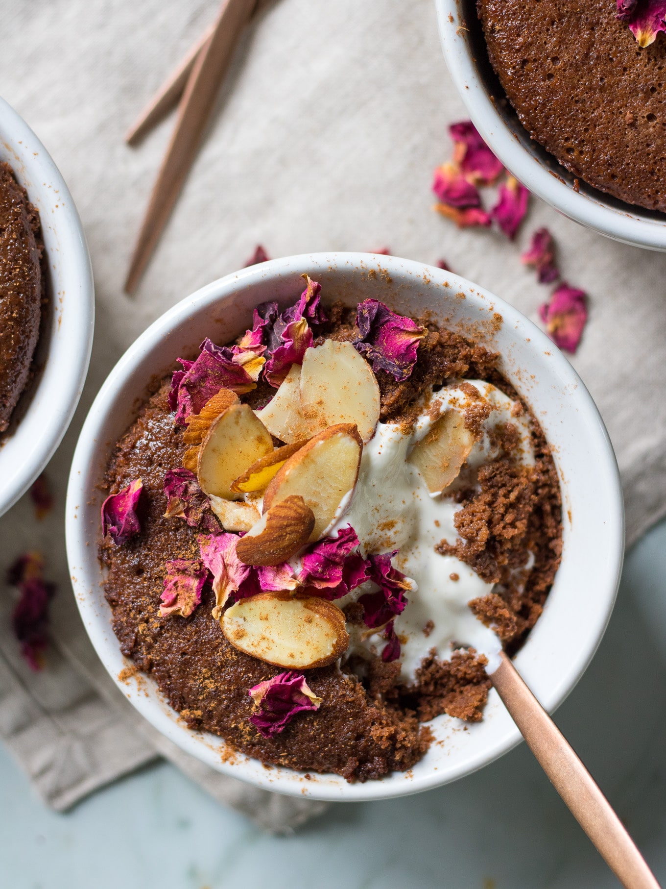 This gorgeous almond chocolate mug cake comes together in MINUTES! Easily made in the microwave, it's gluten free, grain free, dairy free and paleo friendly. #healthy #glutenfree #paleo #mugcake