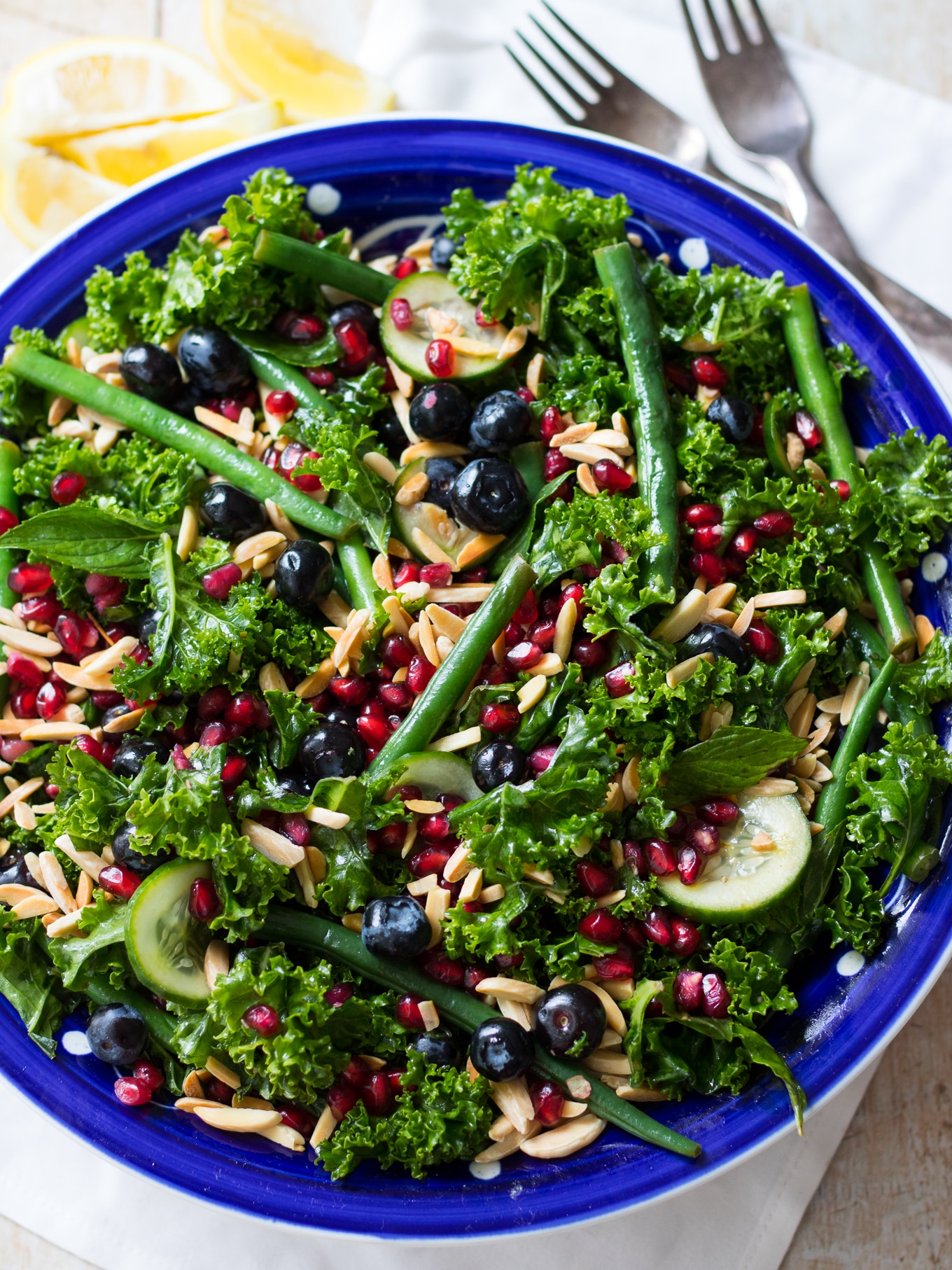 Fresh and vibrant this summery blueberry kale salad combines loads of greens, blueberries and pomegranate. {gluten free, dairy free, grain free, paleo} #kalesalad #blueberries #paleo #healthyrecipe