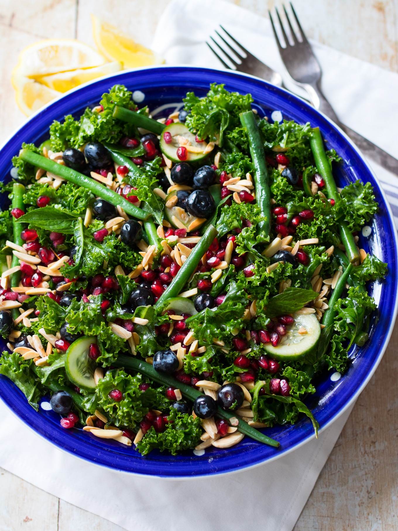 Fresh and vibrant this summery blueberry kale salad combines loads of healthy greens, blueberries and pomegranate. {gluten free, dairy free, grain free, paleo} #kalesalad #blueberries #paleo #healthyrecipe