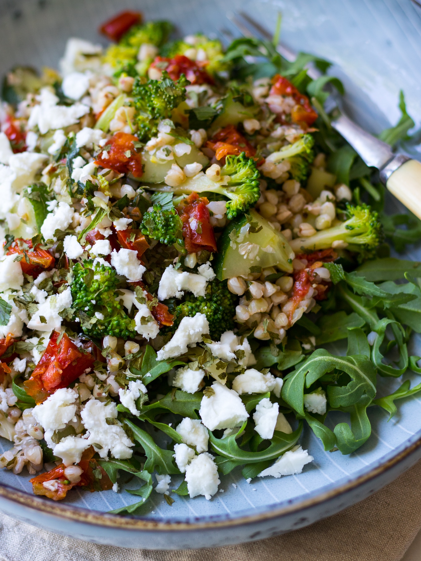 Healthy broccoli buckwheat salad with loads of fresh herbs and semi dried tomatoes for flavour! Feta optional. Easy, delicious, gluten free. #buckwheatsalad