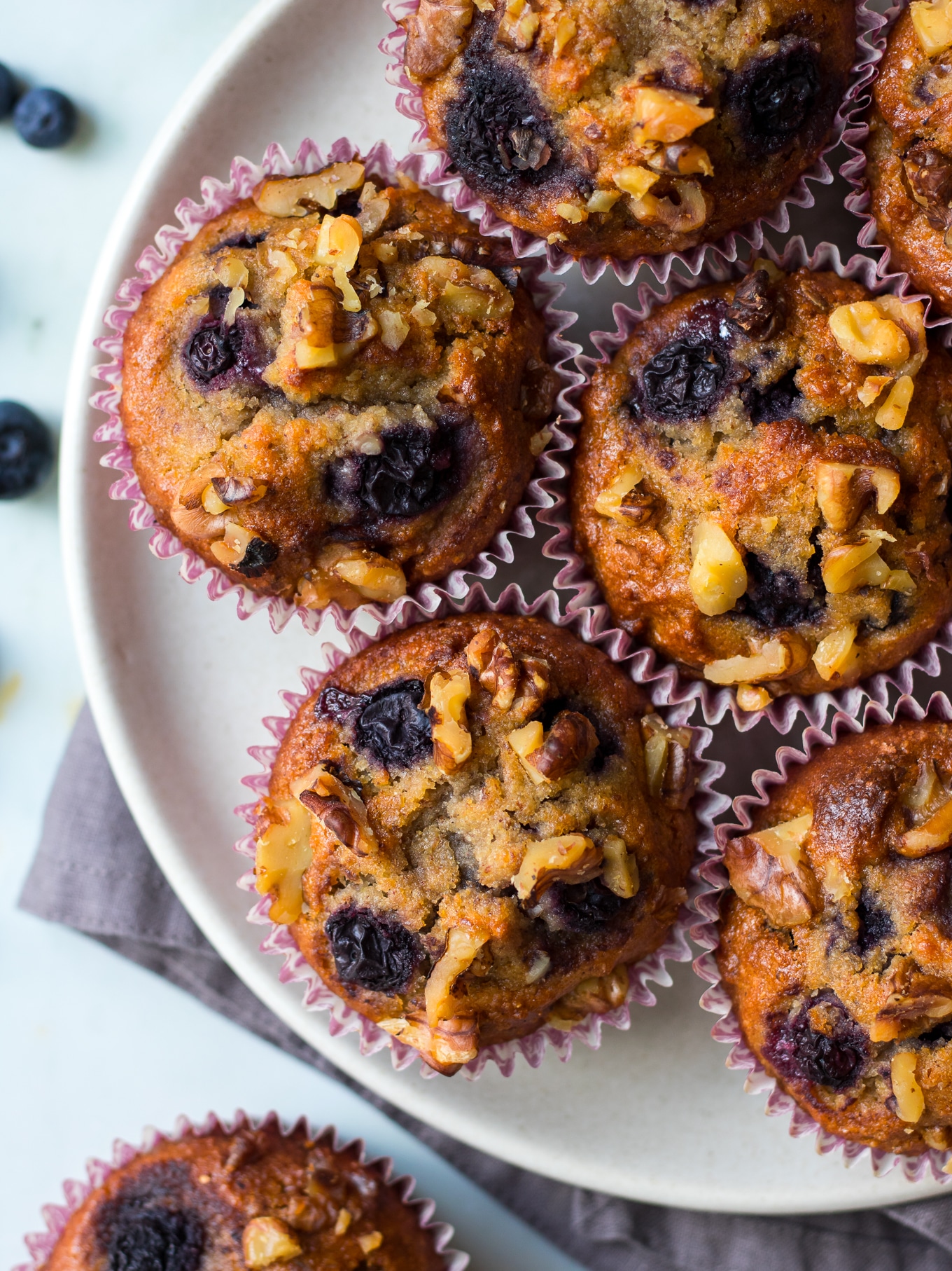 Healthy Blueberry Cinnamon Muffins on white plate