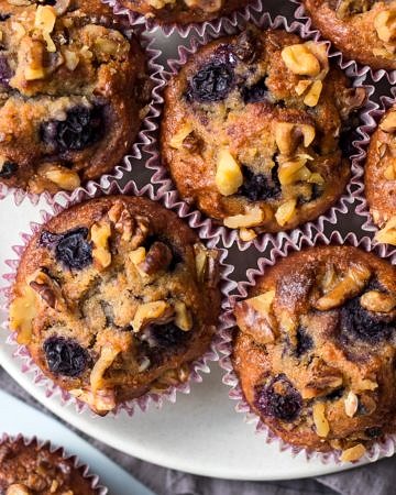 Healthy Blueberry Cinnamon Muffins on white plate