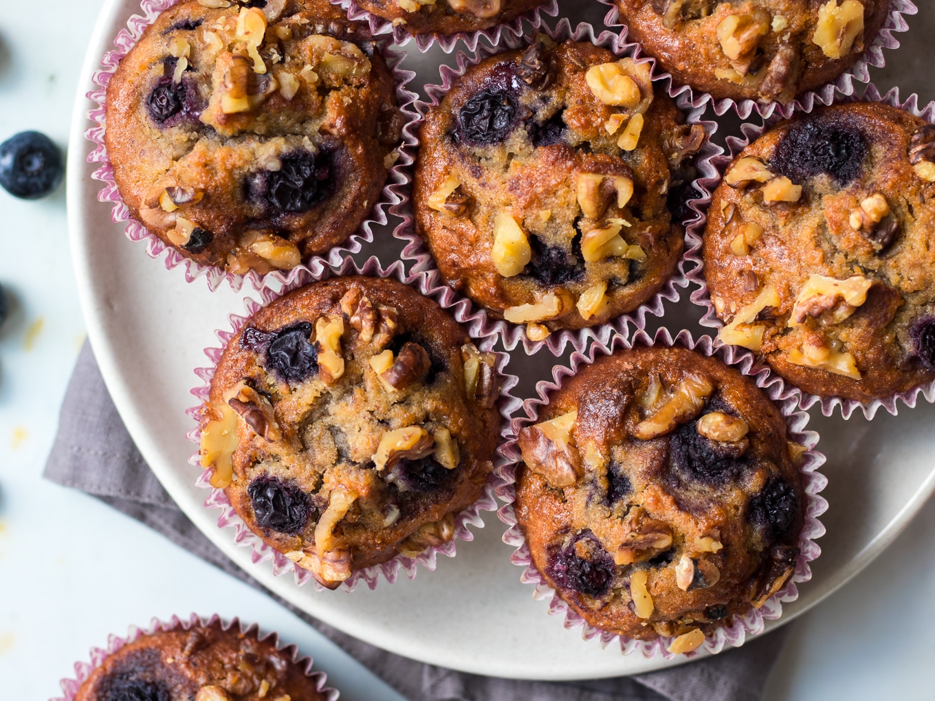 Healthy Blueberry Cinnamon Muffins on white plate
