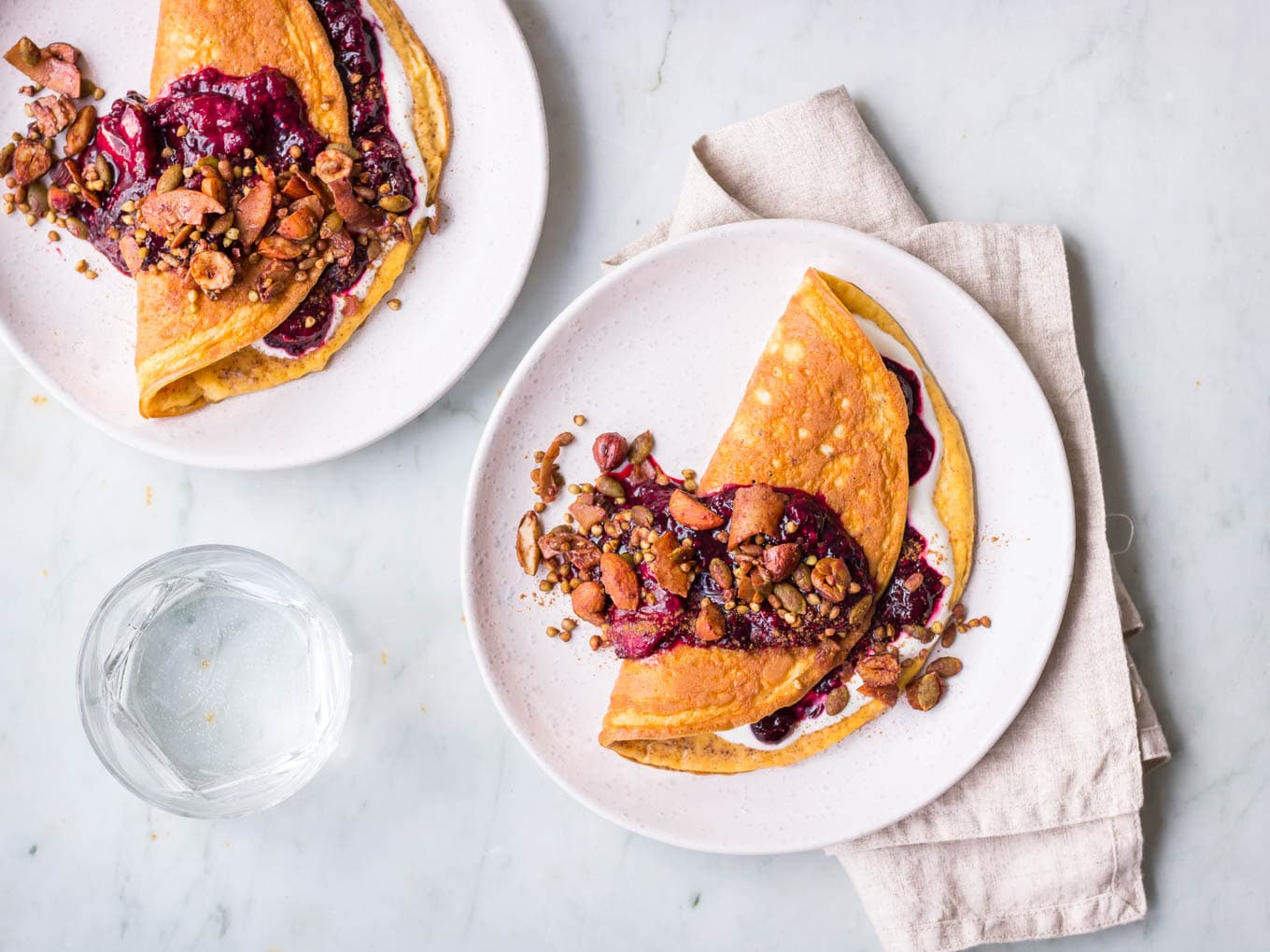Sweet cinnamon omelettes with berry compote and granola topping