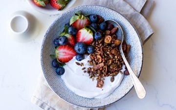 Gluten free cacao hazelnut granola with yoghurt and berries