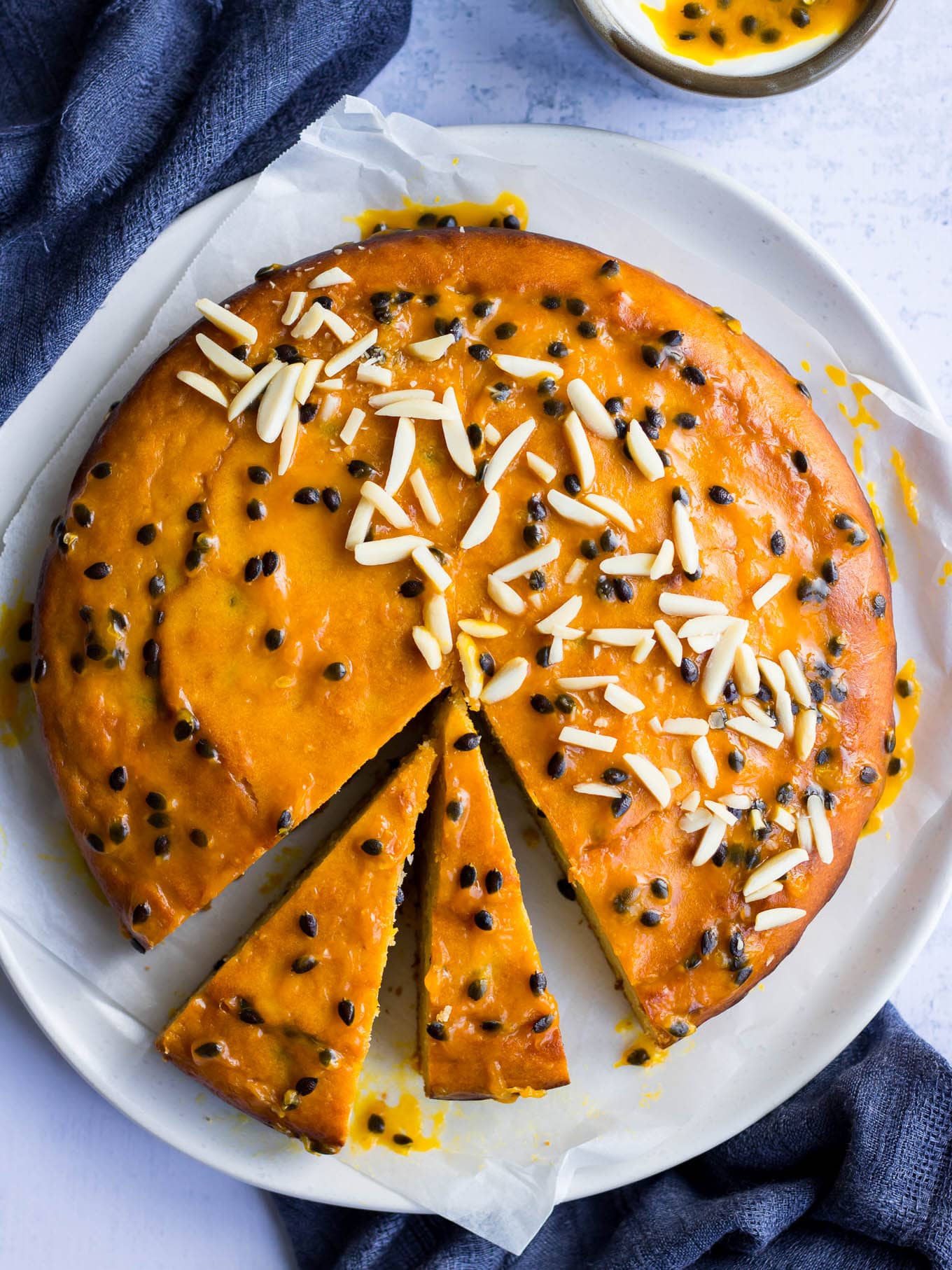 passionfruit yoghurt cake with passionfruit glaze and almonds
