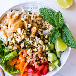 vermicelli noodle bowl with peanut butter sauce, poached chicken and fresh vegetables
