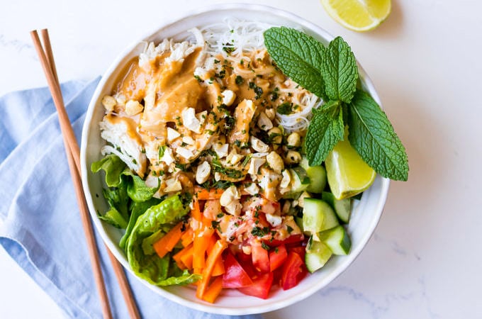 vermicelli noodle bowl with peanut butter sauce, poached chicken and fresh vegetables
