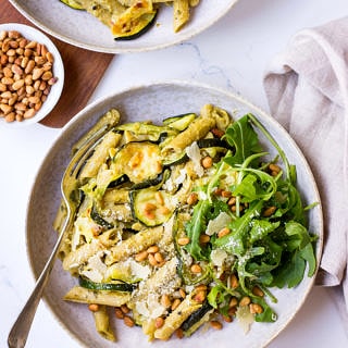 Pesto Pulse Pasta with Roasted Zucchini, Pine Nuts and Parmesan in grey ceramic bowl