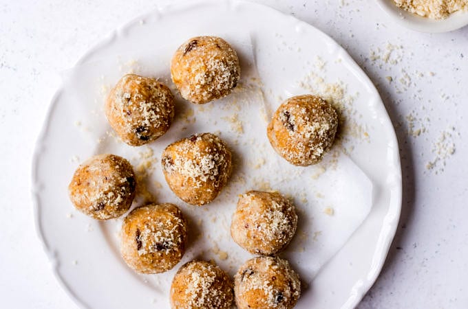 No Bake Lactation Bites Recipe | lactation balls arranged on a white plate (Nourish Every Day)