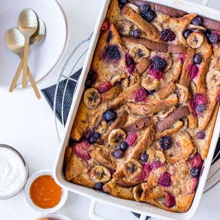 Baked French Toast topped with berries and banana slices