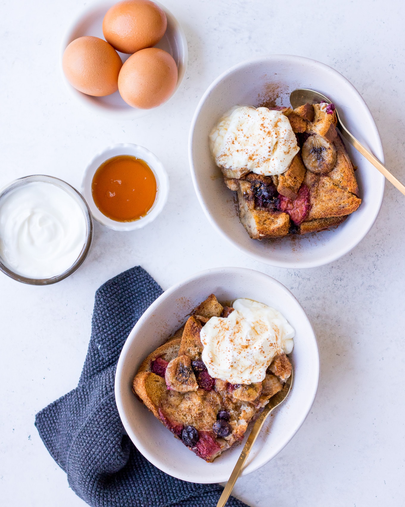 Baked French Toast laid out in bowls with Greek yoghurt