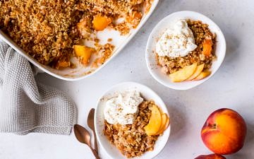Gluten free nectarine crumble topped with yoghurt and cinnamon