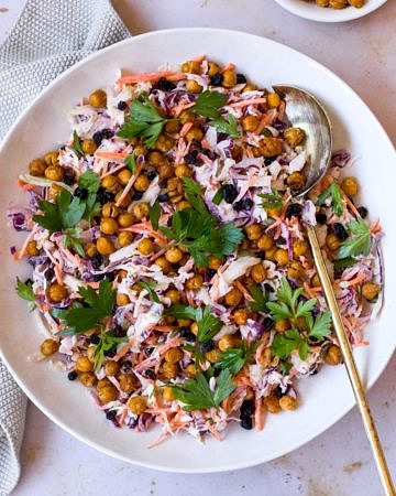 Healthy yoghurt coleslaw topped with roasted chickpeas main shot