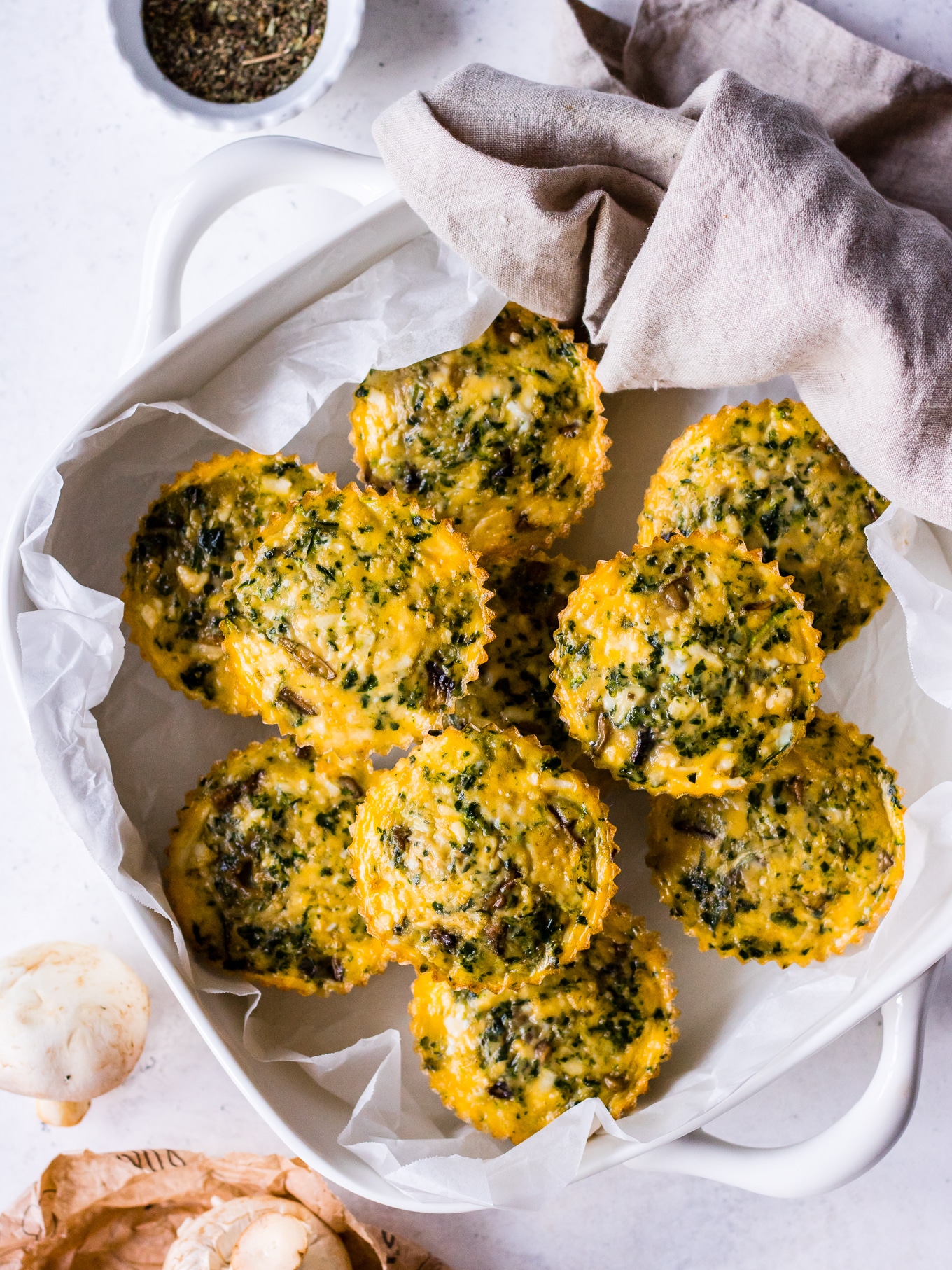 Vegetarian halloumi egg muffins in a white baking dish on Nourish Every Day blog