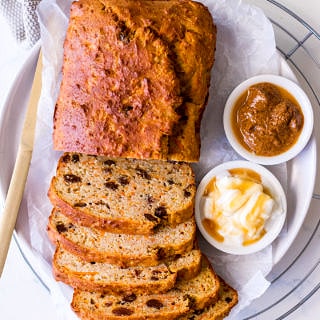 Banana, carrot and sultana loaf cake sliced with ricotta, honey and almond butter