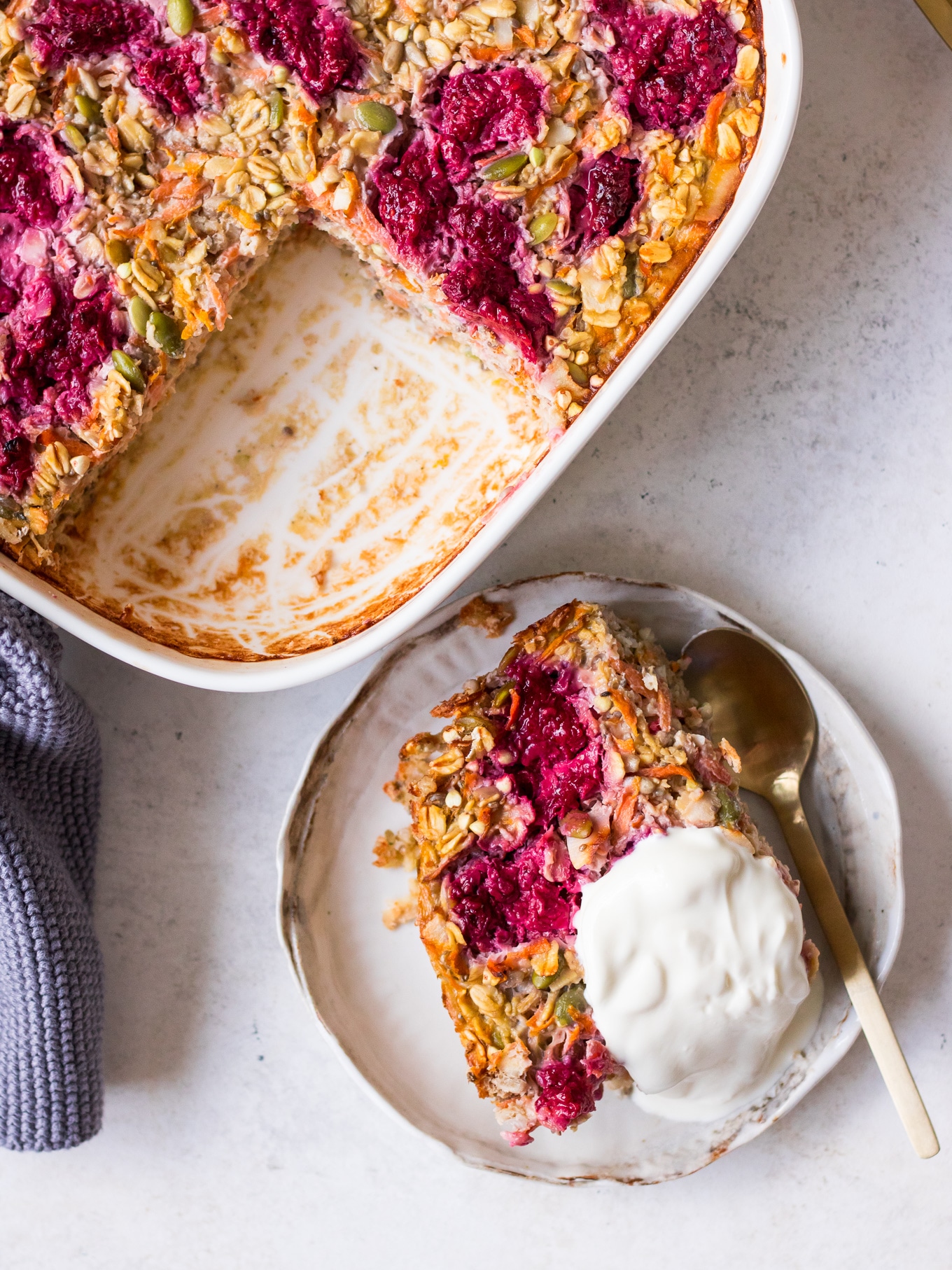 Serving of carrot raspberry baked oats on side plate