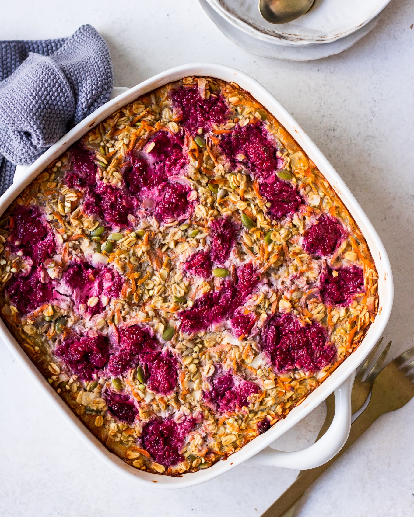 Carrot and Raspberry Baked Oatmeal in a white square dish