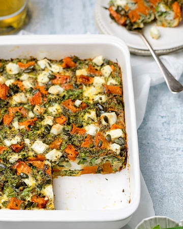 Sweet potato, broccoli and feta frittata in a white rectangular baking dish
