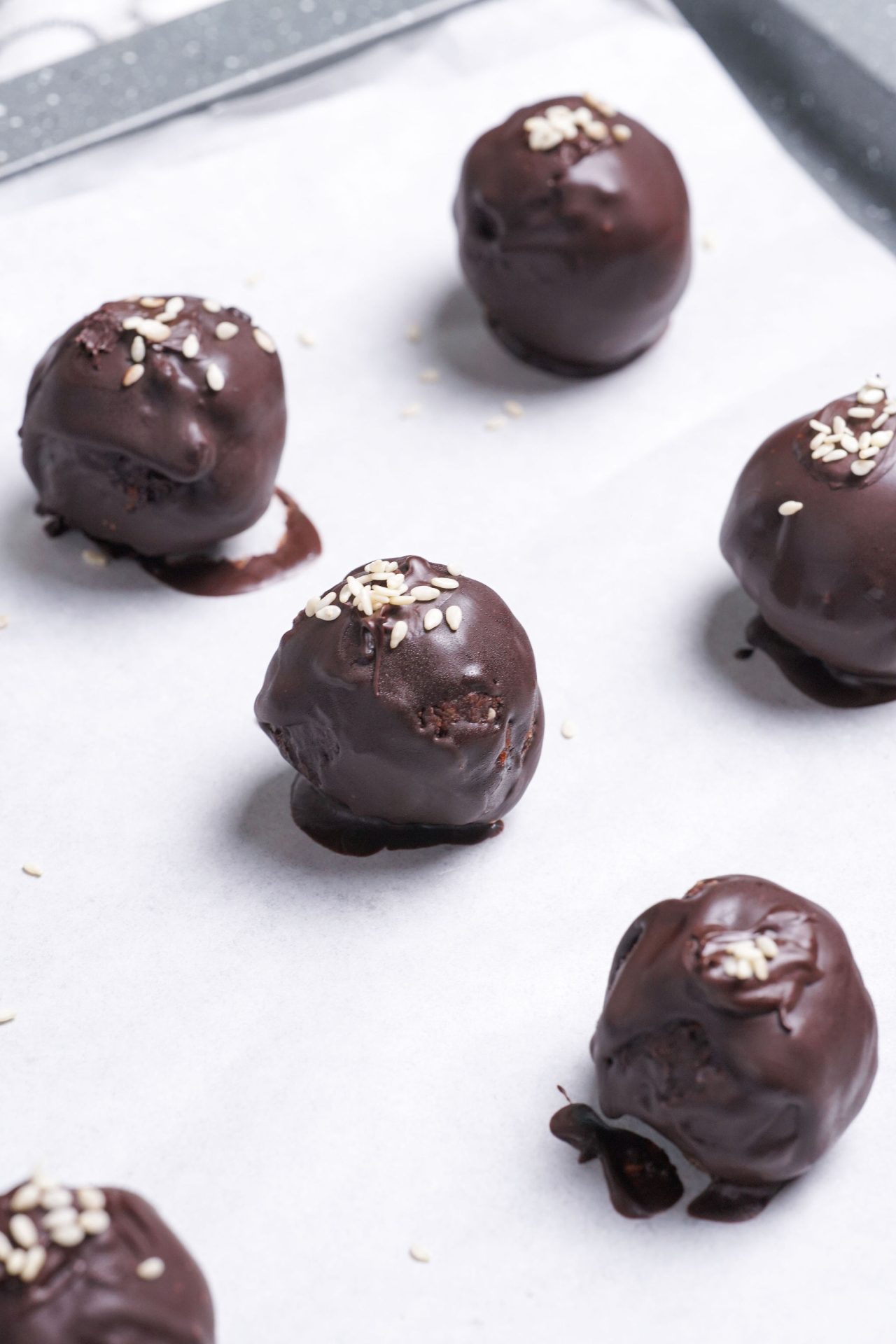 Healthy chocolate truffles made with nuts and medjool dates. Coated in dairy free dark chocolate.