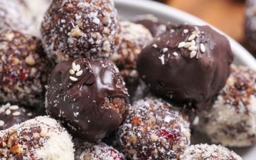 Cranberry and date healthy chocolate truffles made with cacao and medjool dates