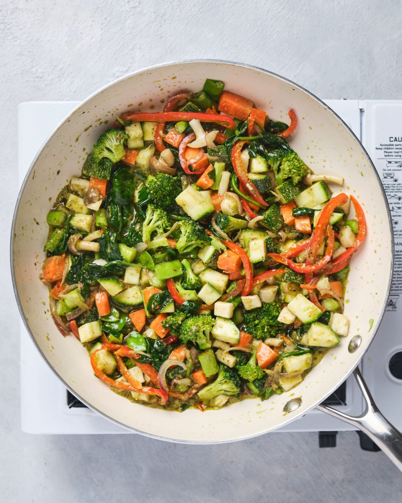 photo of sauteed vegetables in a white frying pan