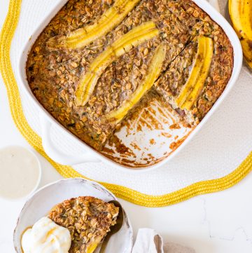 Baked banana zucchini oatmeal in a square white baking dish