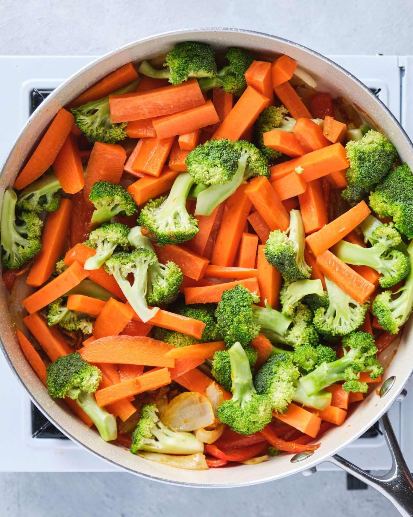 Chopped vegetables cooking in a frypan
