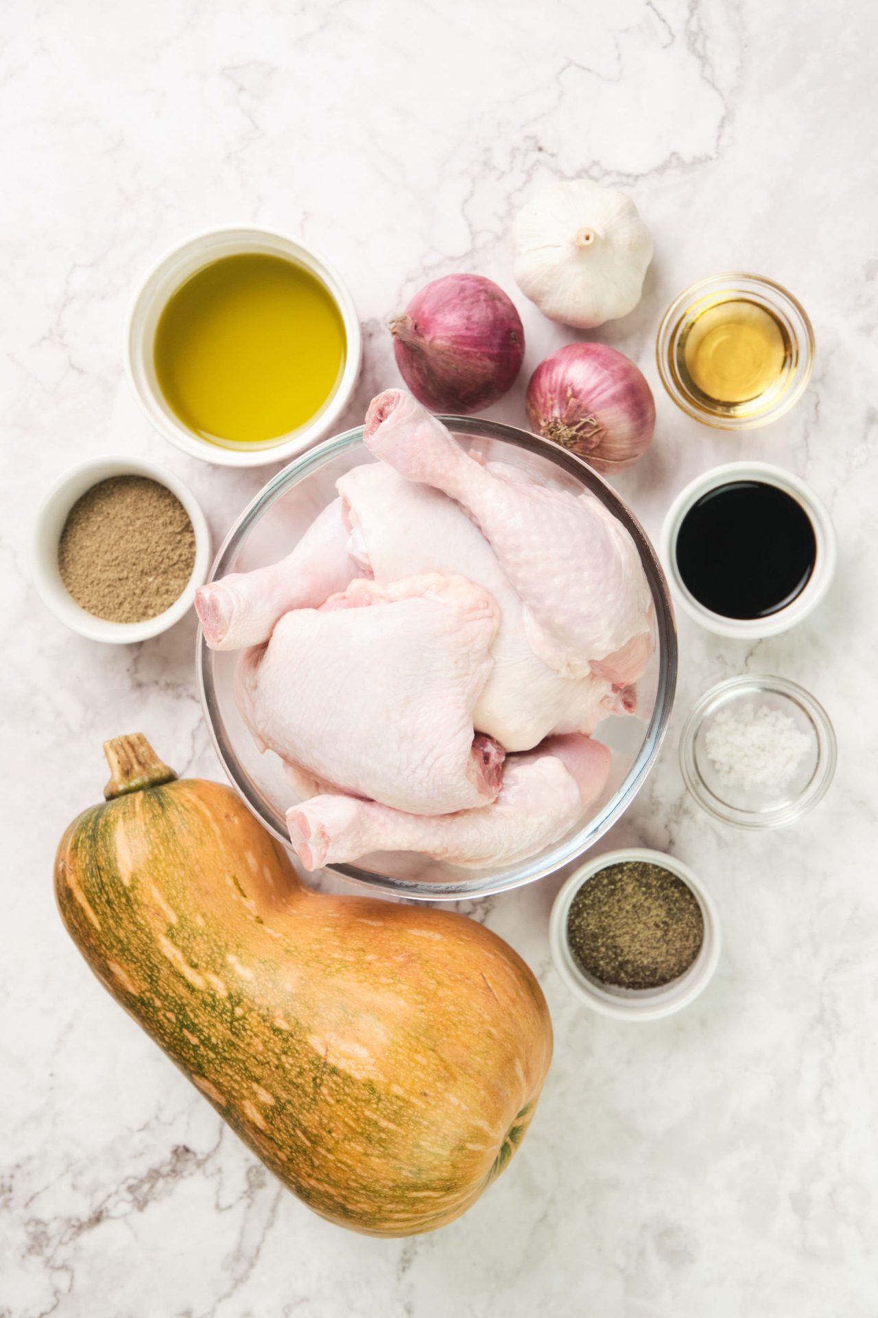 Ingredients to make roast chicken with sage, pumpkin and onion
