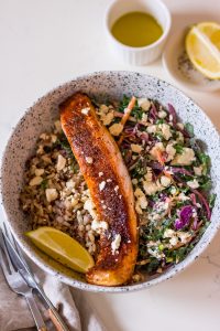Image of brown sugar glazed salmon fillet in a bowl with slaw and brown rice
