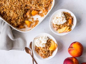 Gluten free nectarine crumble topped with yoghurt and cinnamon